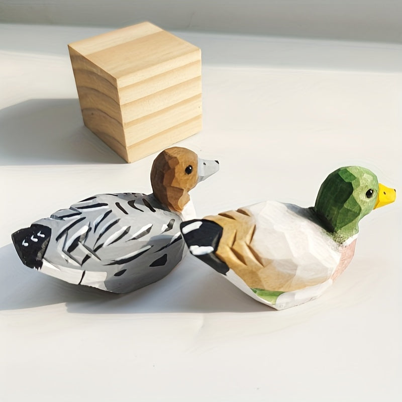 Handcrafted wooden figurines of a green duck – male and female